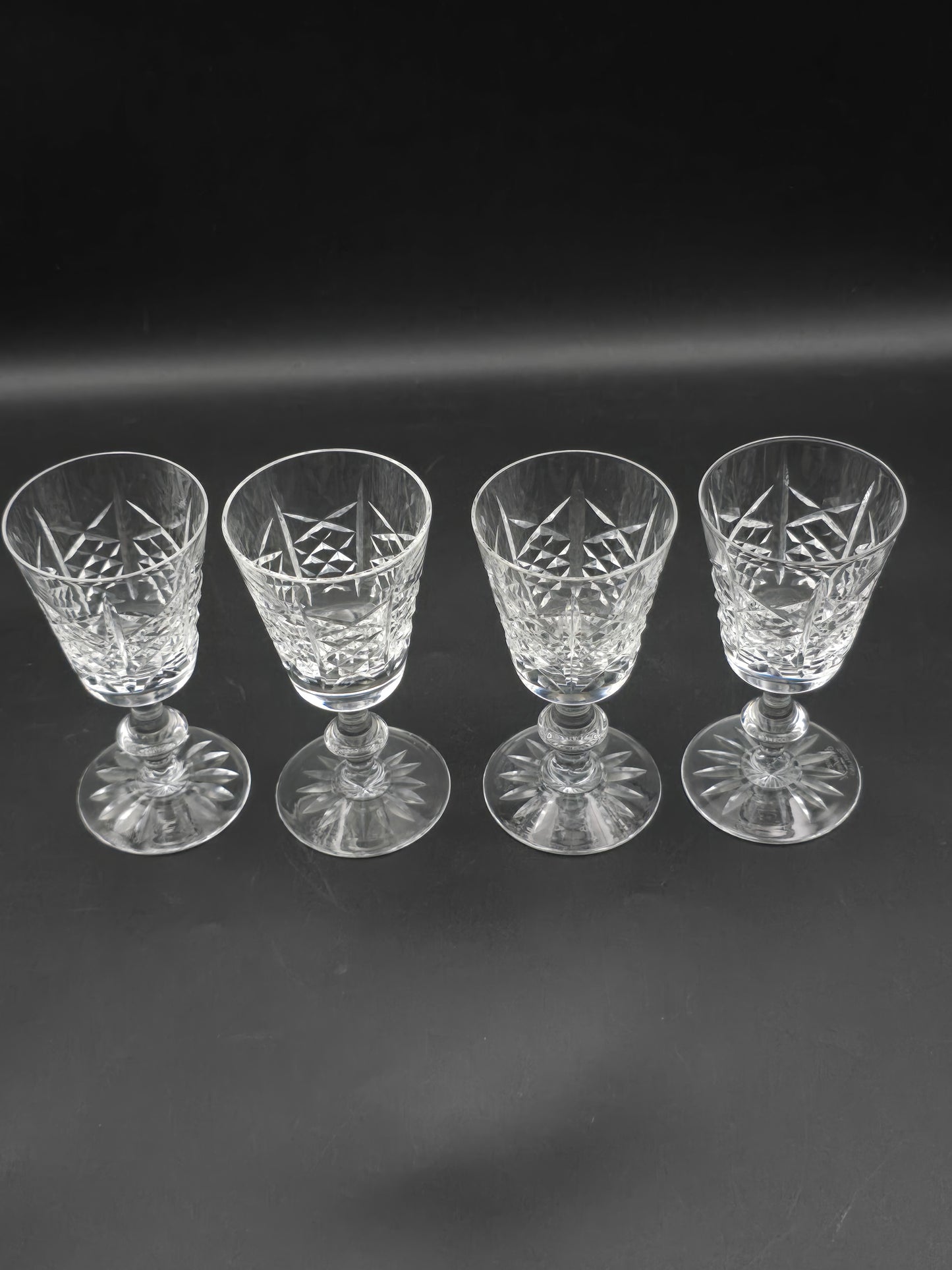 Set of 4 Edinburgh Crystal Highland pattern Crystal sherry or liqueur glasses 75ml. 11.5cm tall