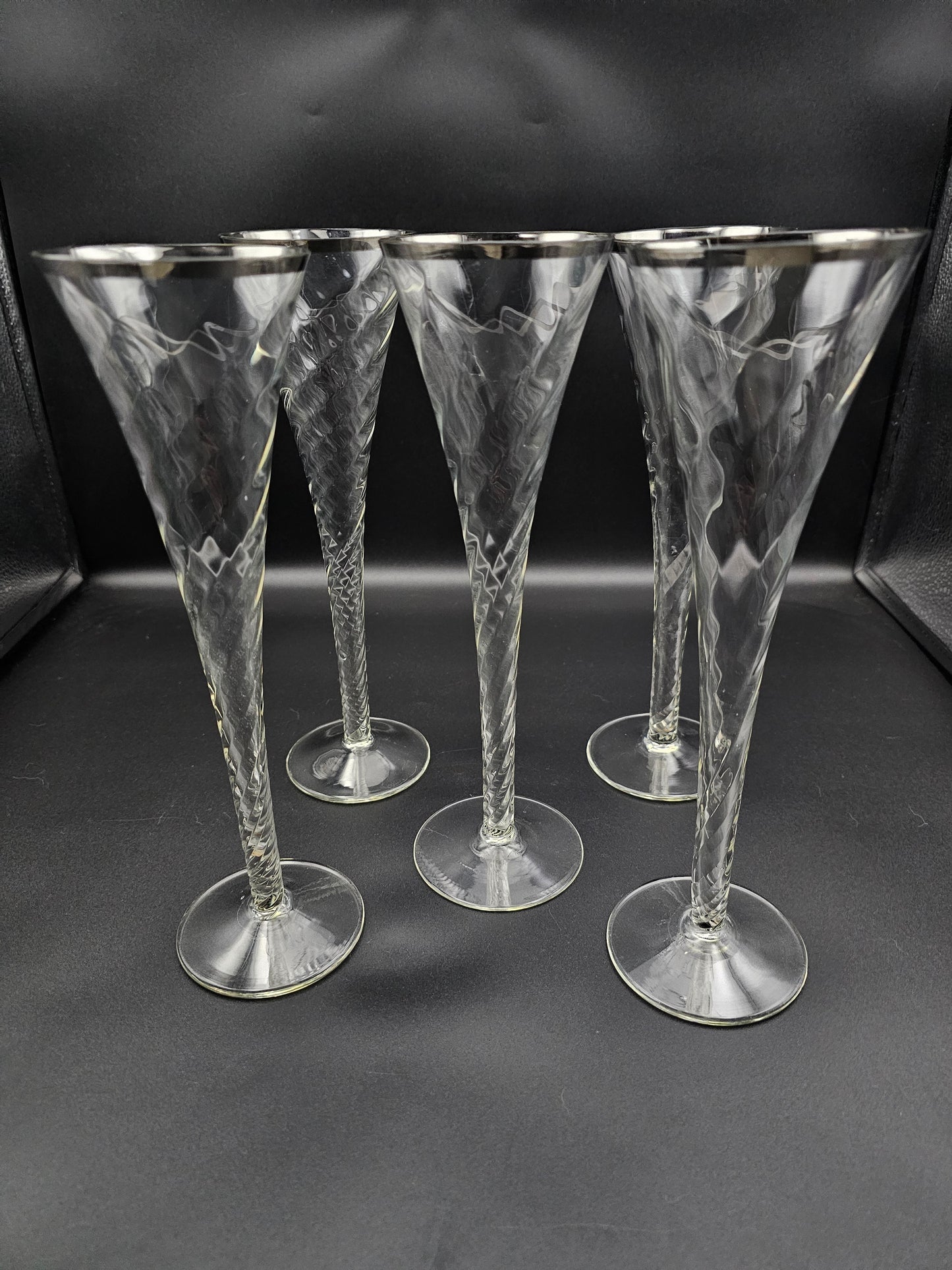 5 Hollow stemmed Tall Crystal Champagne flutes with silver coloured rims. 25cm tall. 200ml