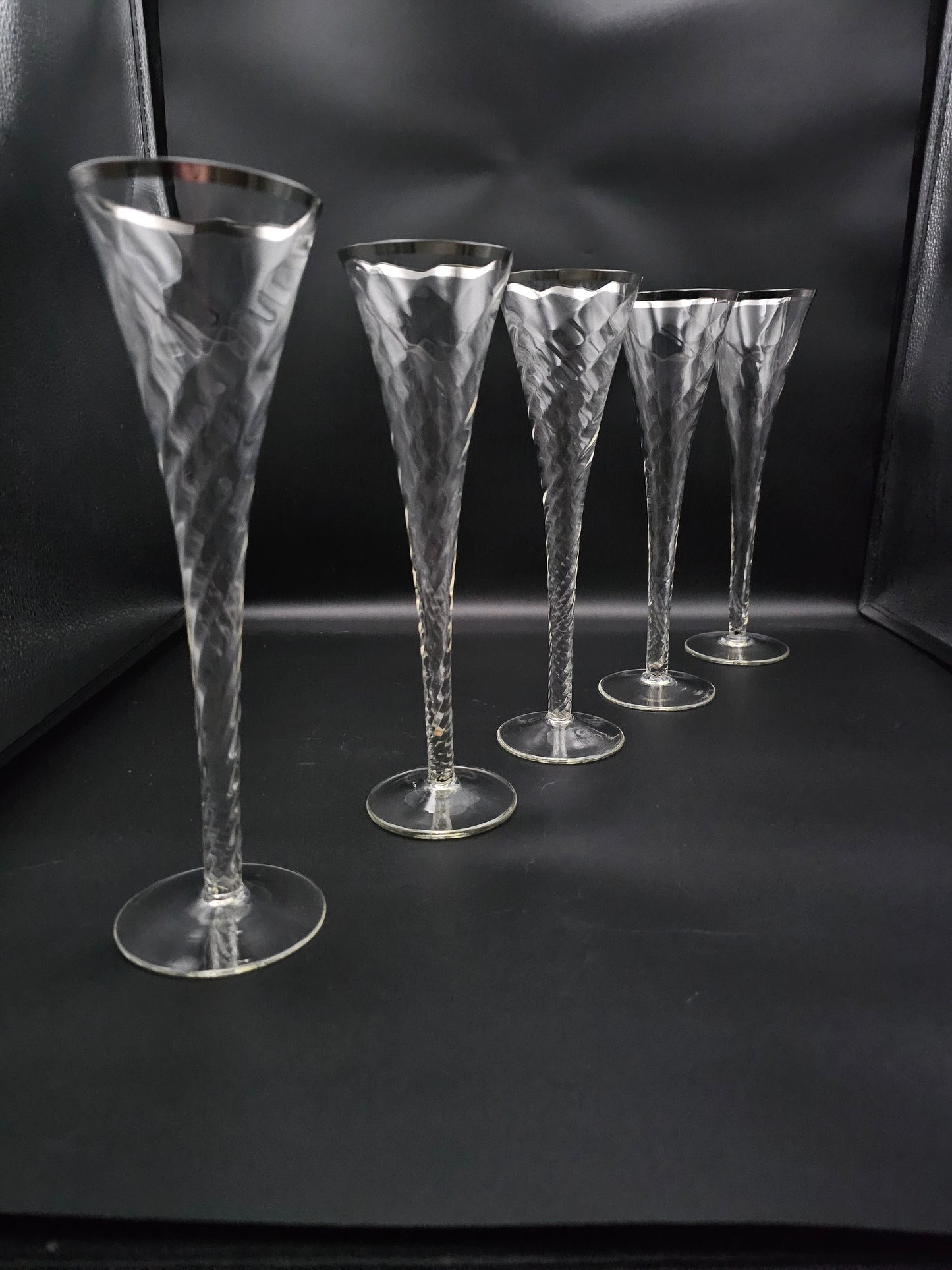 5 Hollow stemmed Tall Crystal Champagne flutes with silver coloured rims. 25cm tall. 200ml