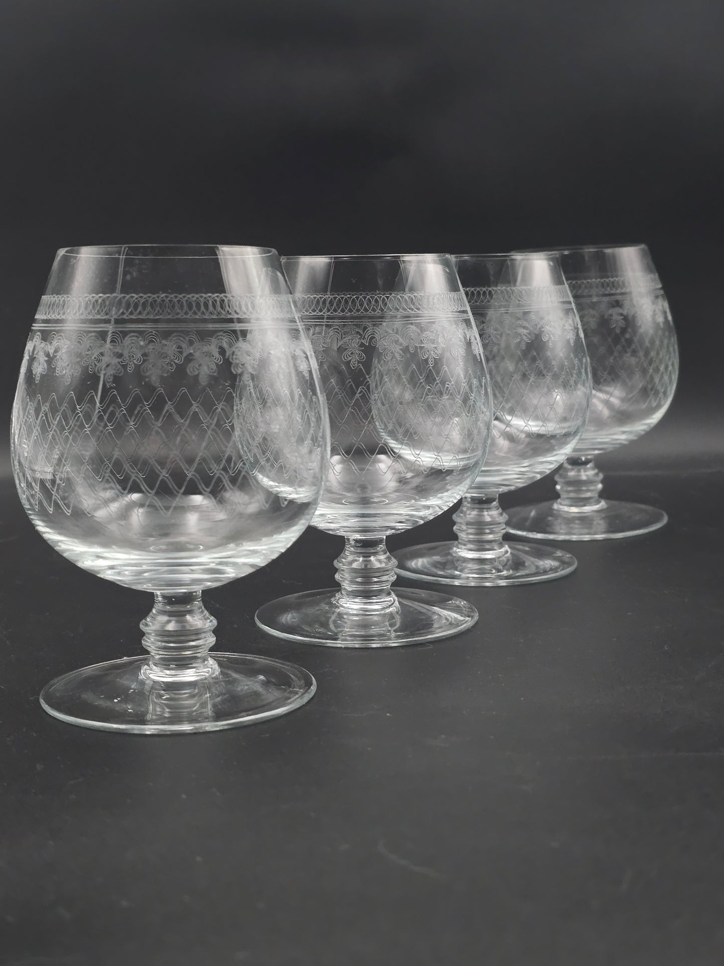 Set of 4 large, fine etched Crystal Brandy glasses. 13oz