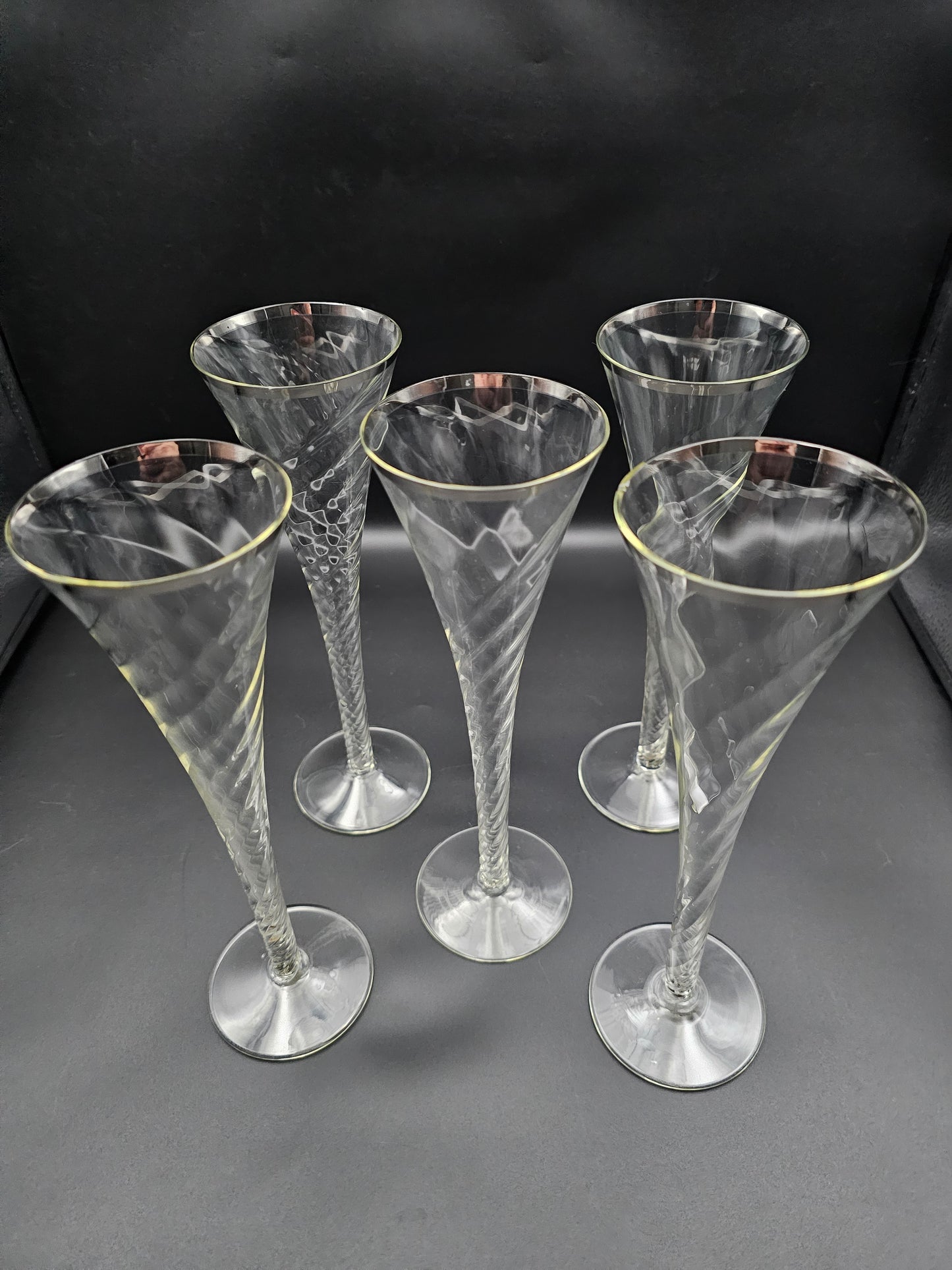 5 Hollow stemmed Tall Crystal Champagne flutes with silver coloured rims. 25cm tall. 200ml