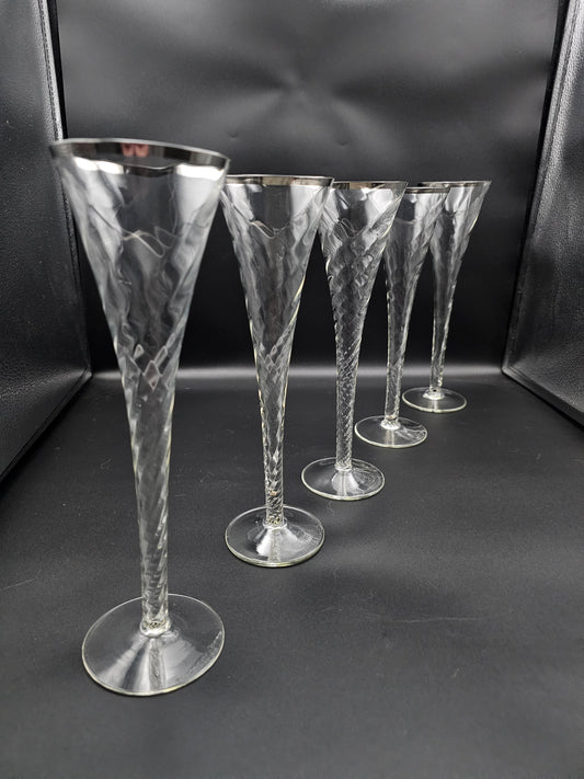 5 Hollow stemmed Tall Crystal Champagne flutes with silver coloured rims. 25cm tall. 200ml