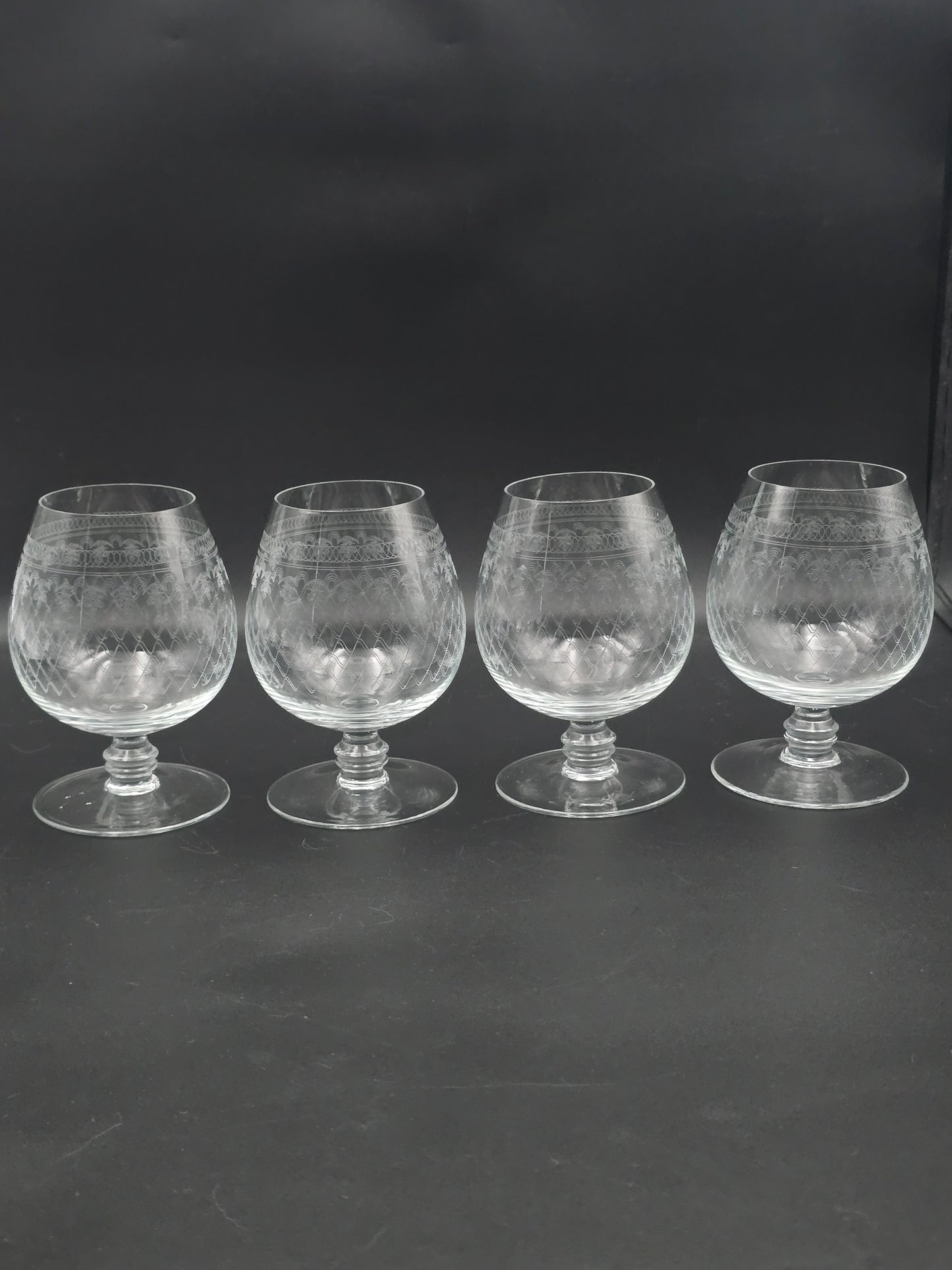 Set of 4 large, fine etched Crystal Brandy glasses. 13oz
